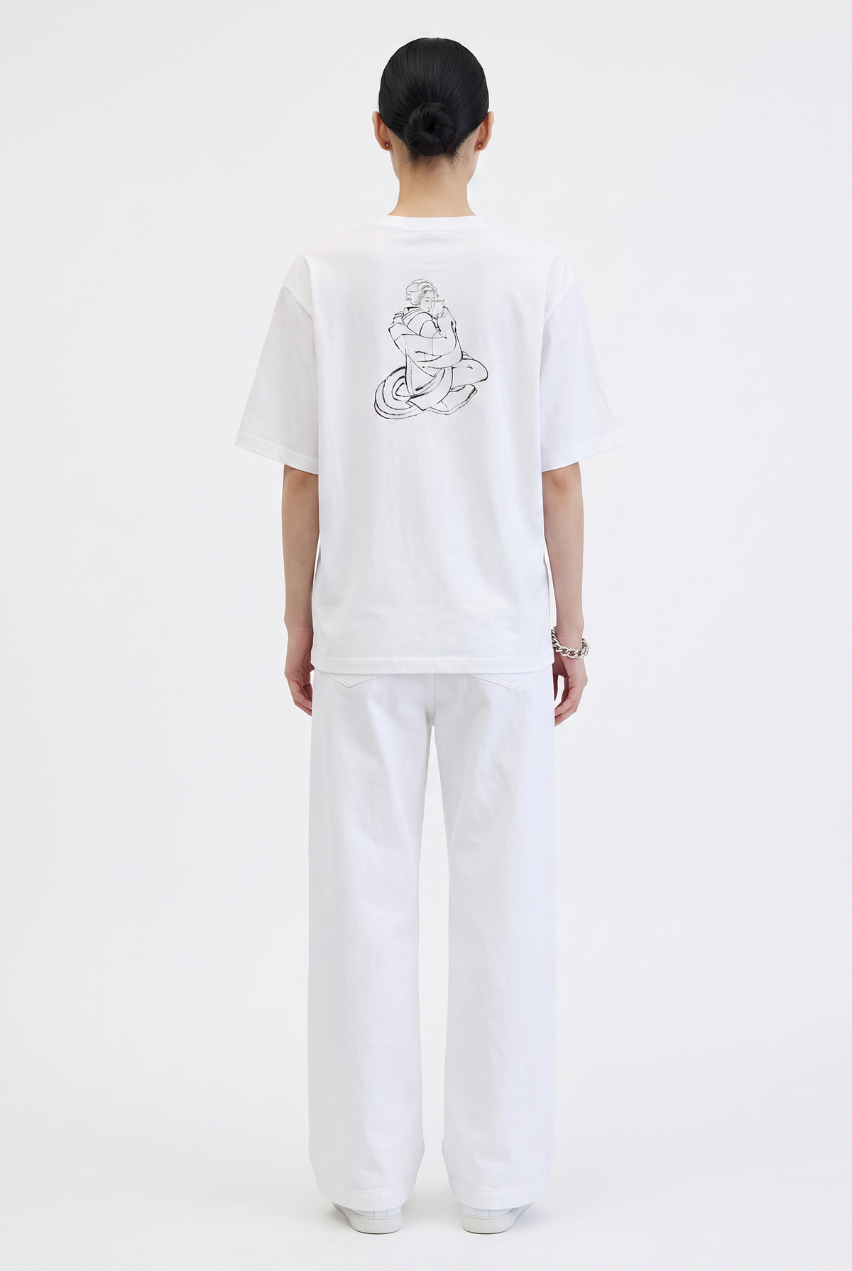 Model wearing the Hokusai Bond with Cats graphic T-shirt featuring Katsushika Hokusai's cat sketch.