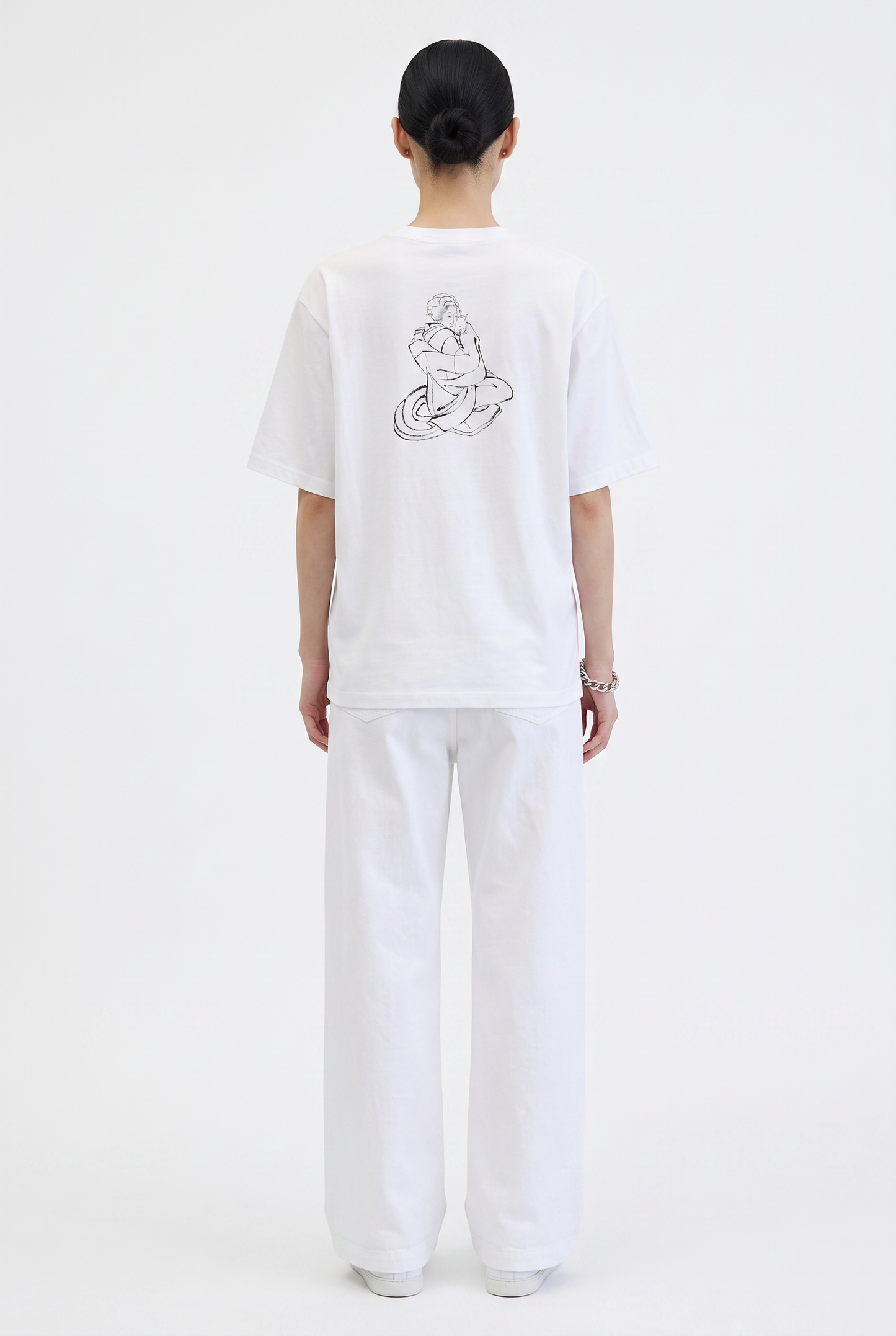 Model wearing the Hokusai Bond with Cats graphic T-shirt featuring Katsushika Hokusai's cat sketch.